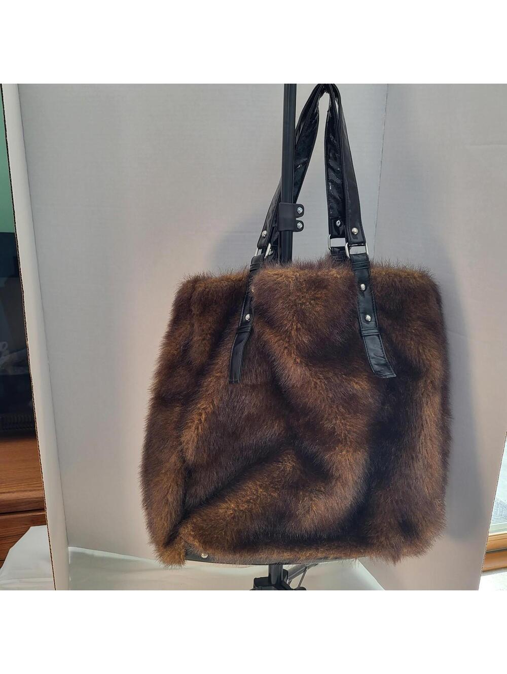 K.I.T  faux fur brown handbag with black leather straps with hot pink snap clos